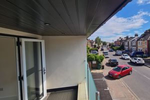 View from balcony down road- click for photo gallery